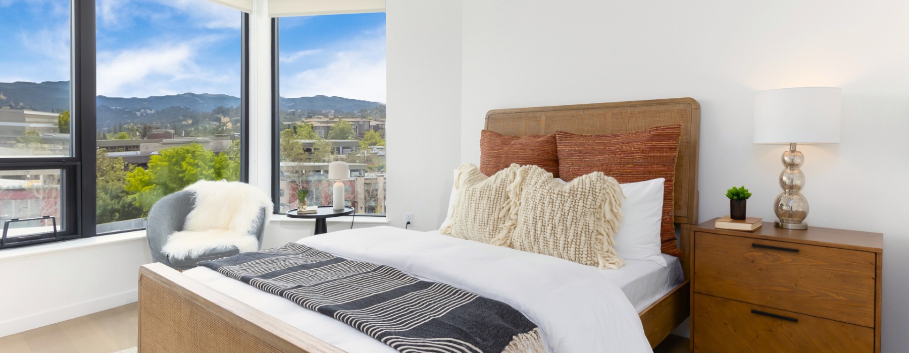 bedroom with large windows and views of walnut creek