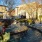 Plaza water fountain with plants surrounding